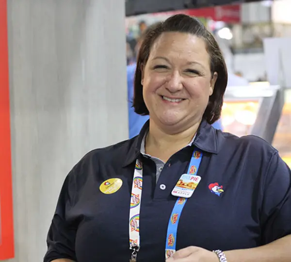 Person wearing a uniform with badges.